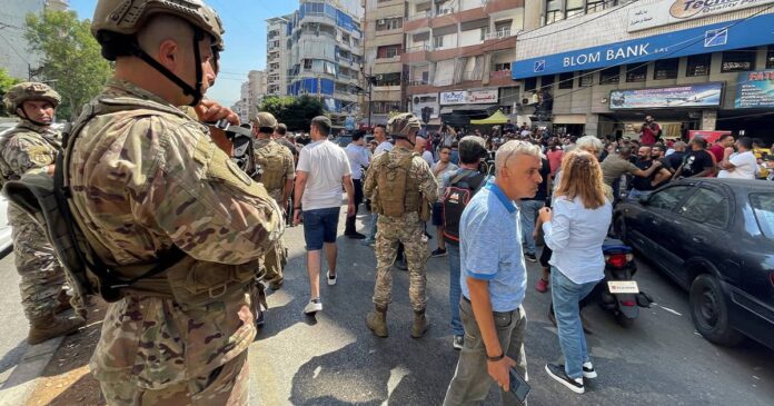 Financial collapse in Lebanon results in armed storms into four commercial banks, Banks strike