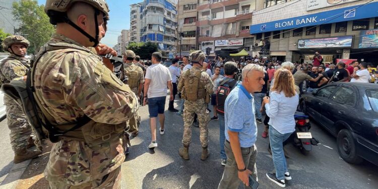 Financial collapse in Lebanon results in armed storms into four commercial banks, Banks strike